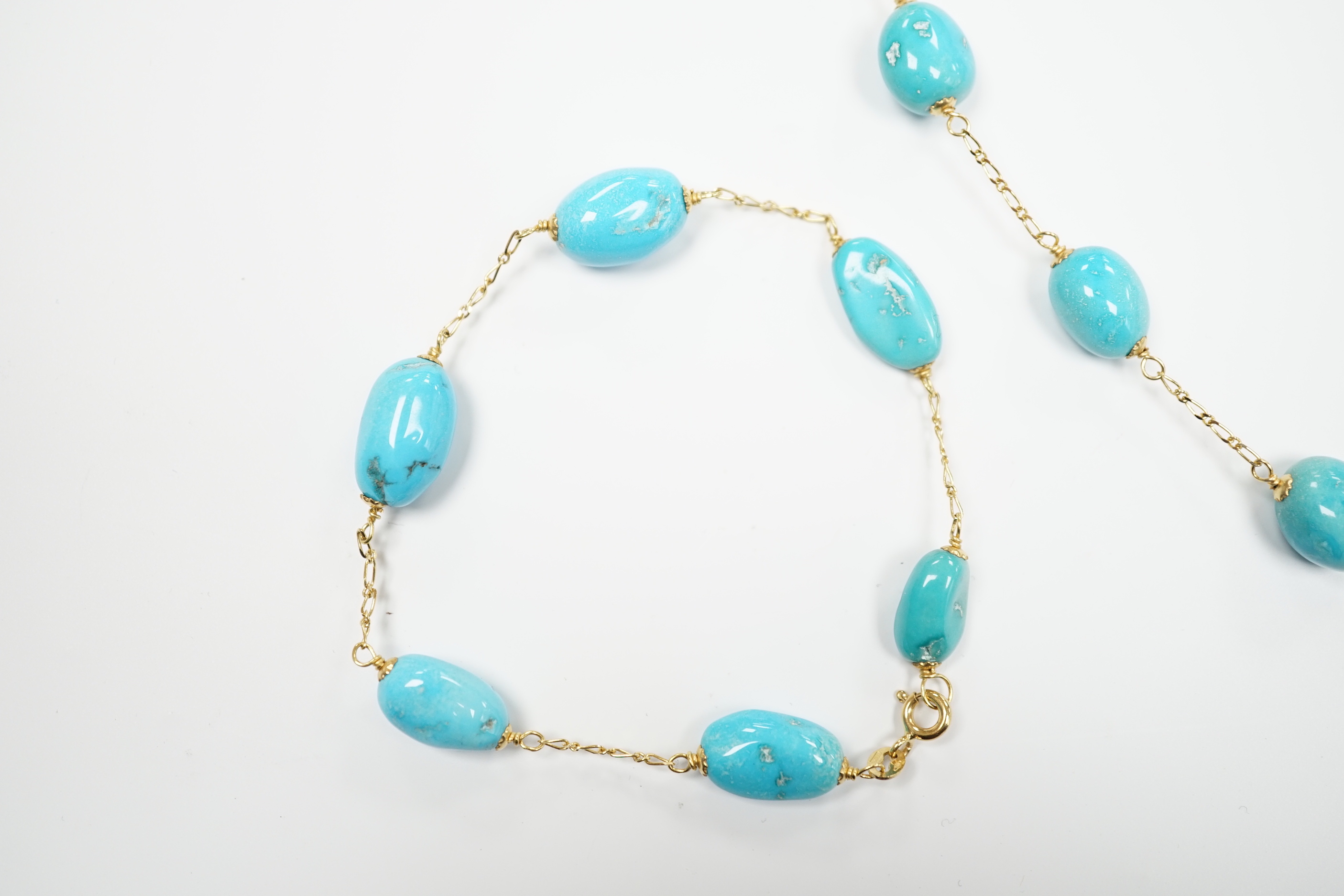 A modern Italian 750 and turquoise set drop necklace (a.f.), 54cm and a matching bracelet, gross weight 24.6 grams.